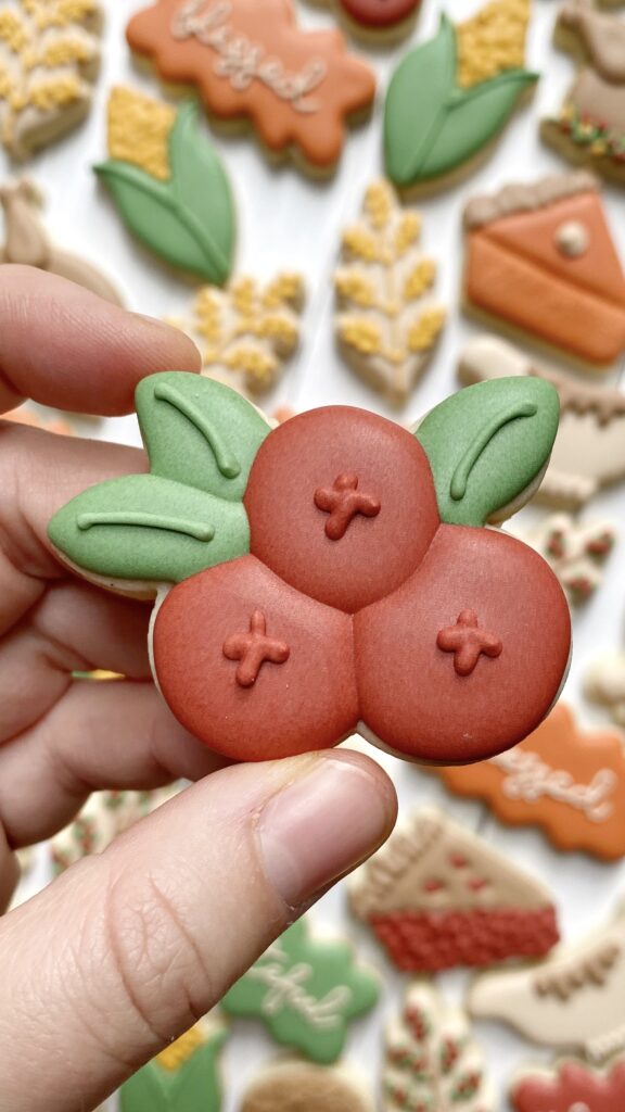 cranberries cookie decorated with royal icing 