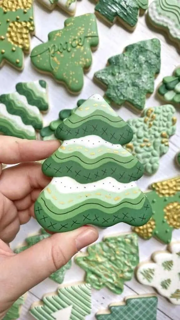 christmas tree cookie decorated with royal icing 