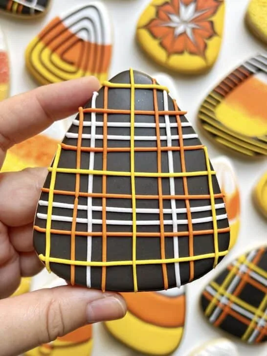 cookie decorated with black royal icing 