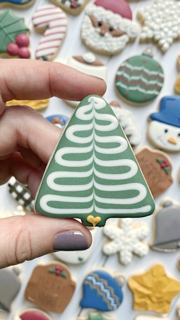 christmas tree cookie decorated with royal icing 