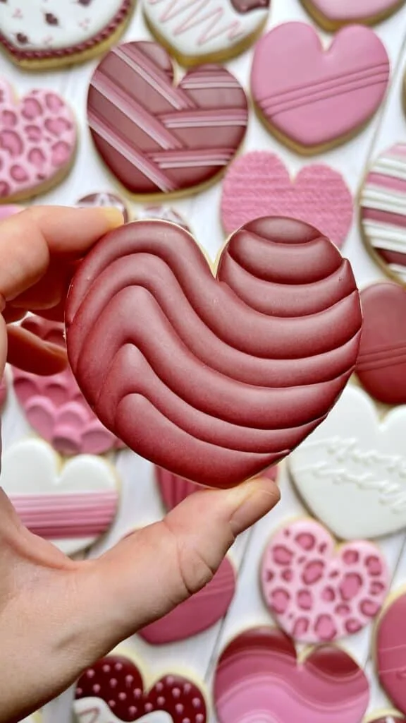 heart cookie decorated with royal icing 
