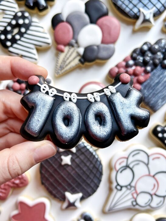 balloon garland cookie decorated with black royal icing