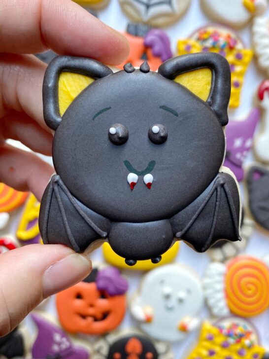 bat cookie decorated with black royal icing