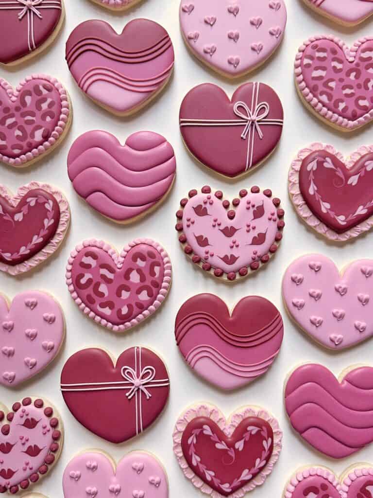 photo of heart cookies with perfect royal icing consistency not too thick or too thin