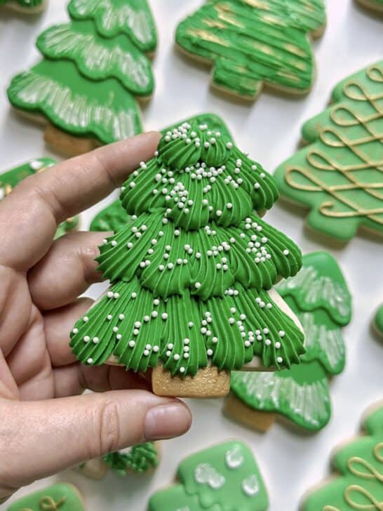 christmas tree cookie decorated with royal icing to demonstrate how much icing is needed for details
