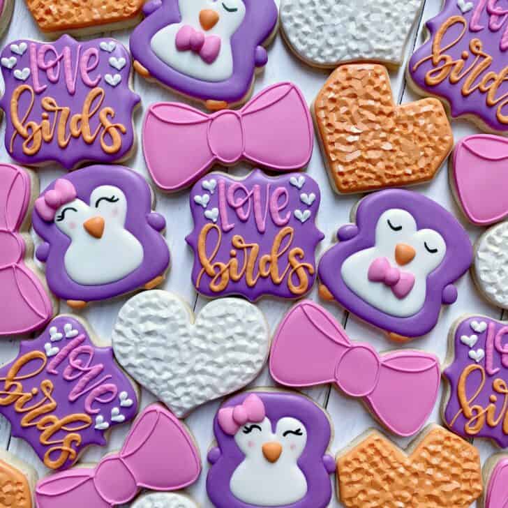photo of set of love bird sugar cookies decorated with royal icing 