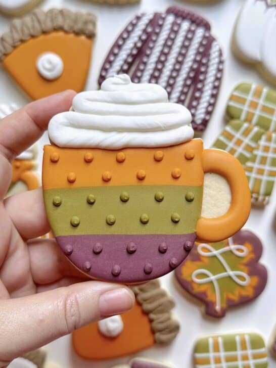 mug cookie decorated with royal icing to demonstrate how much icing is needed for details