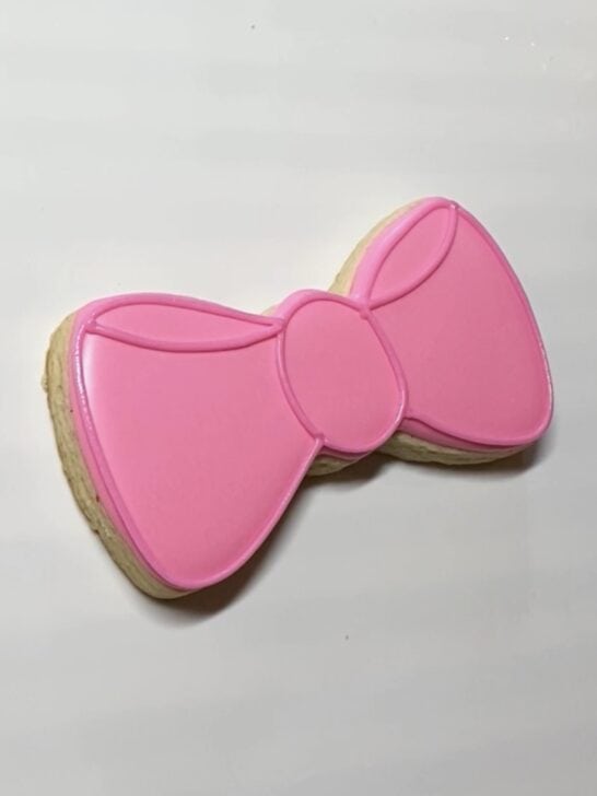 step 2 decorating bow tie cookies with royal icing