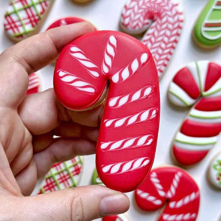 red wet on wet Candy Cane Decorated Cookies with royal icing