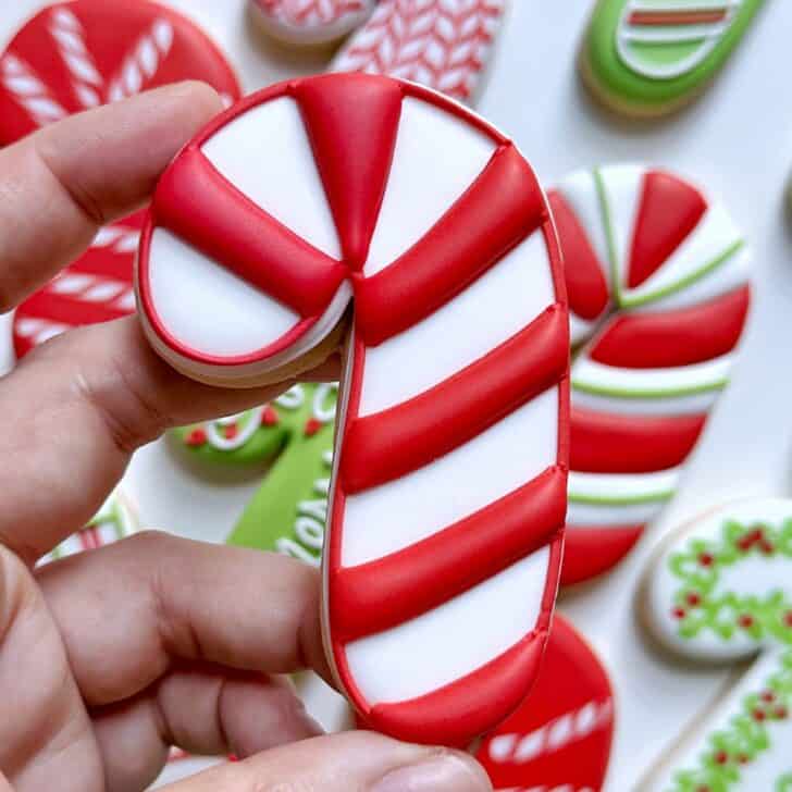 red and white stripe Candy Cane Decorated Cookies with royal icing