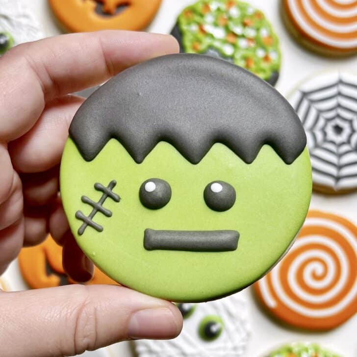 photo of circle frankenstein monster halloween cookie decorated with royal icing