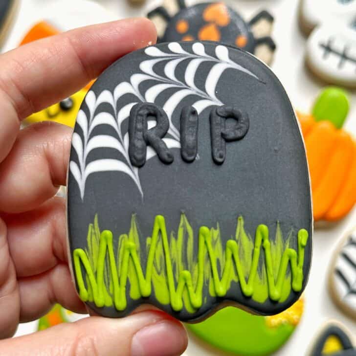 photo of tombstone halloween cookie decorated with royal icing