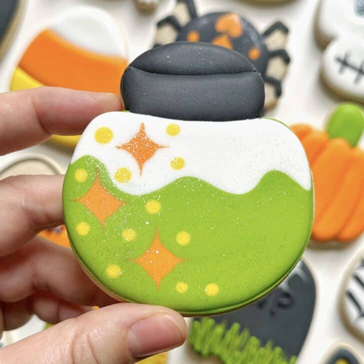 photo of poison halloween cookie decorated with royal icing
