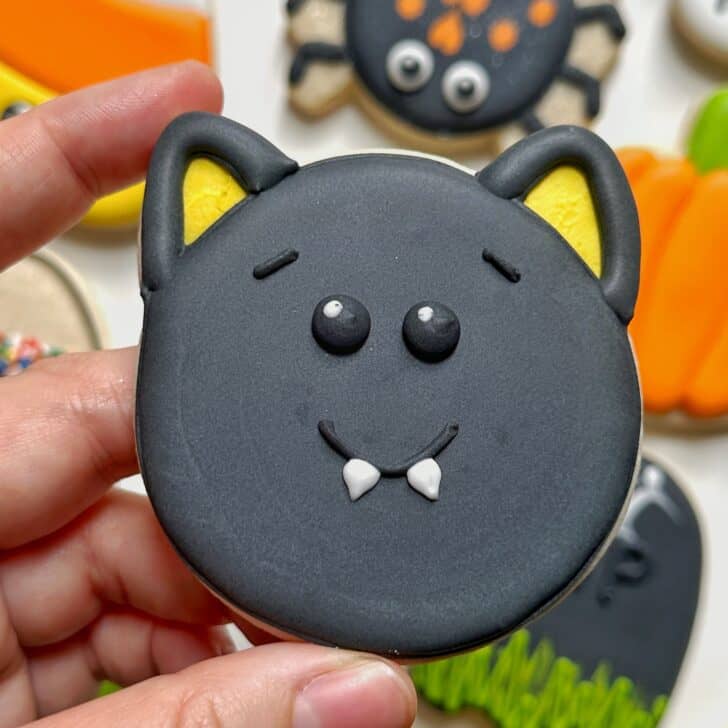 photo of bat halloween cookie decorated with royal icing