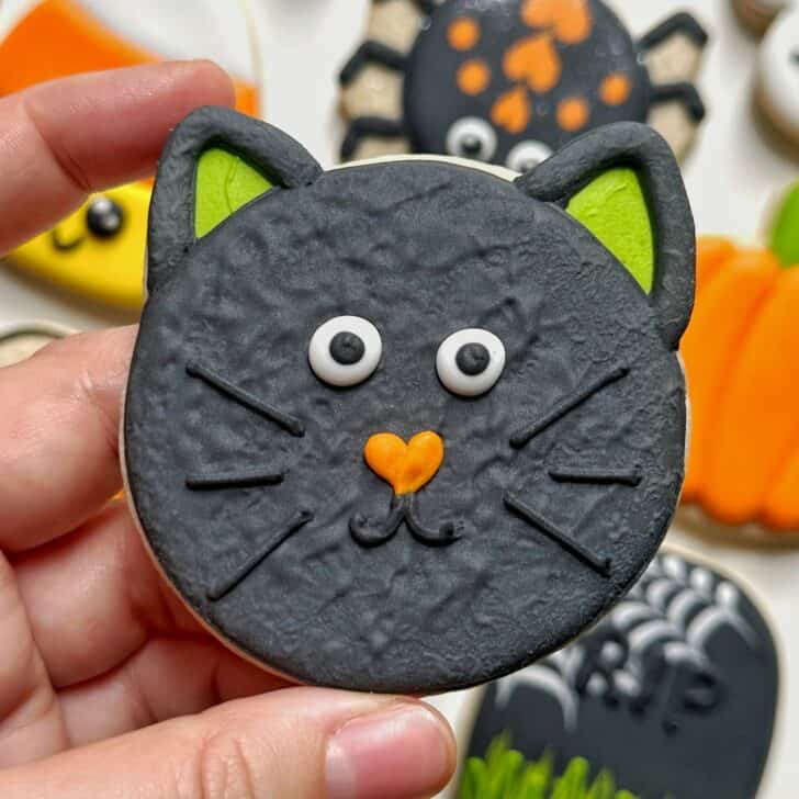photo of bat halloween cookie decorated with royal icing
