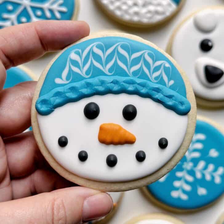 snowman cookies decorated with royal icing