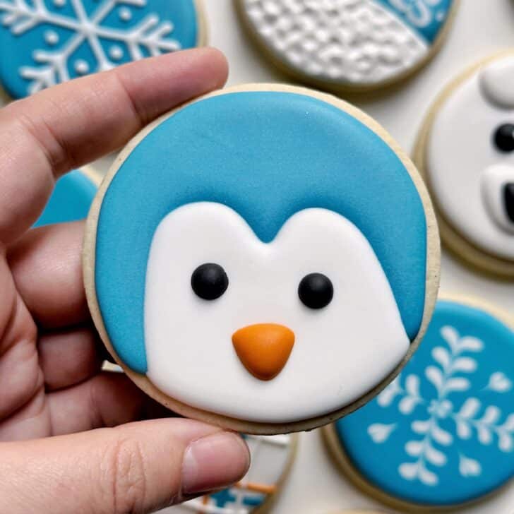 penguin cookies decorated with royal icing
