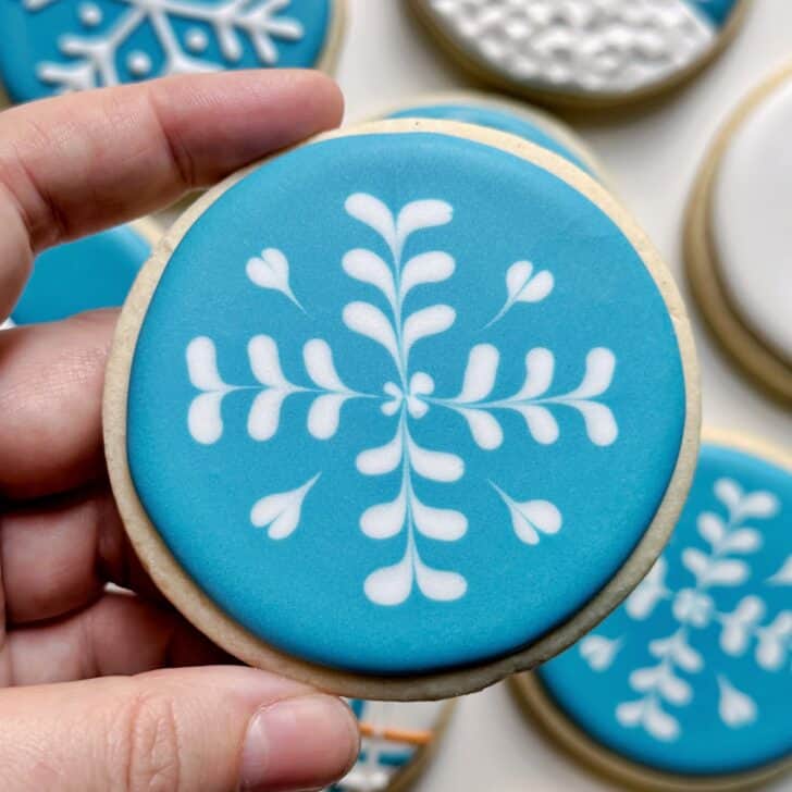 snowflake cookies decorated with royal icing