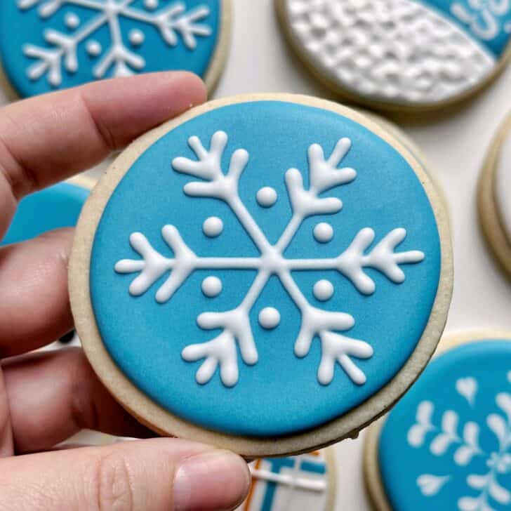 snowflake cookies decorated with royal icing