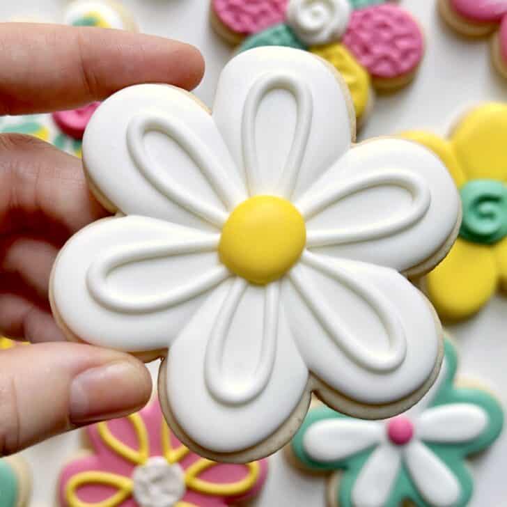 white daisy flower cookies decorated with royal icing