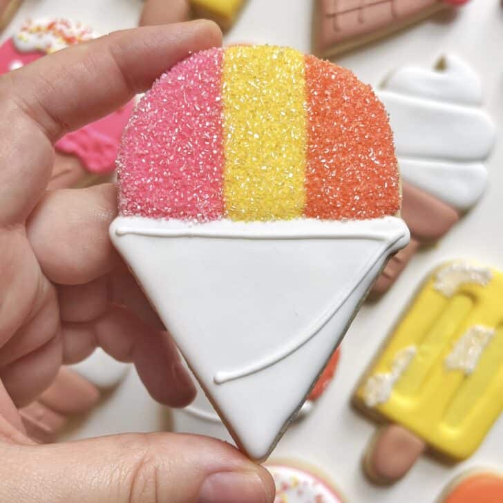 snow cone cookie decorated with royal icing