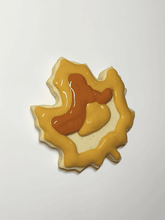 how to decorate a maple leaf cookie with royal icing