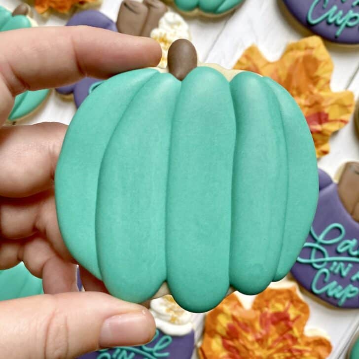 pumpkin cookie decorated with royal icing