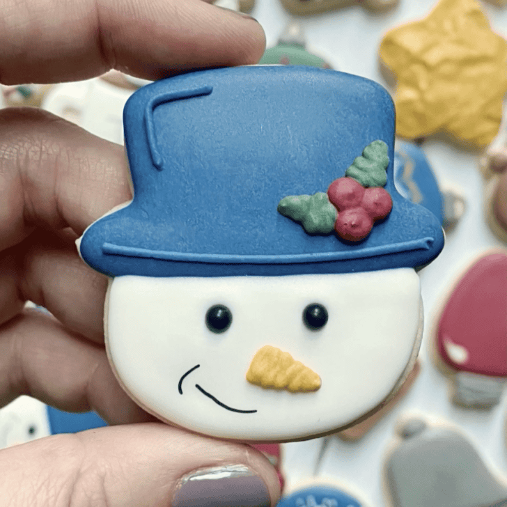 snowman cookie decorated with royal icing