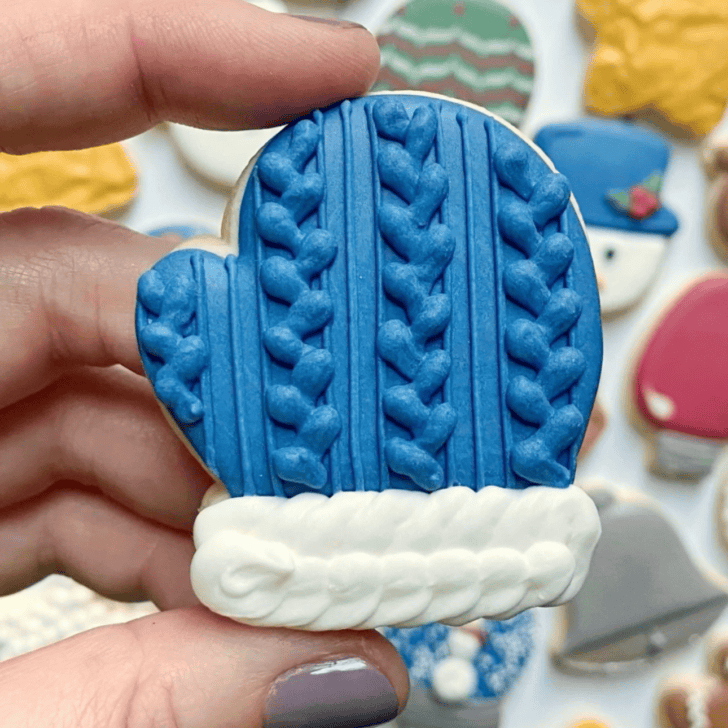 mitten cookie decorated with royal icing