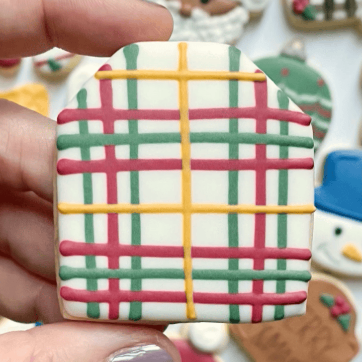christmas gift tag cookie decorated with royal icing