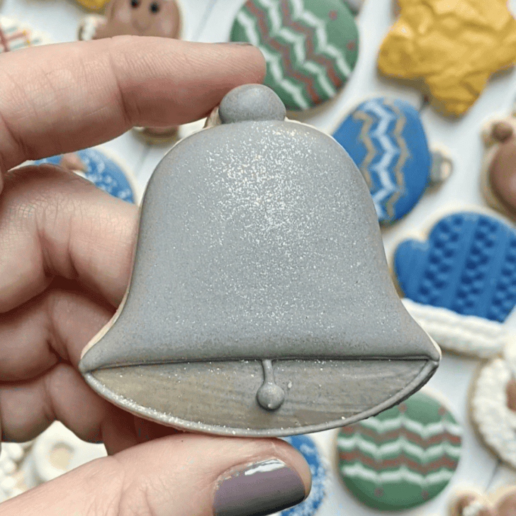 bell cookie decorated with royal icing
