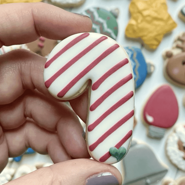 candy cane cookie decorated with royal icing