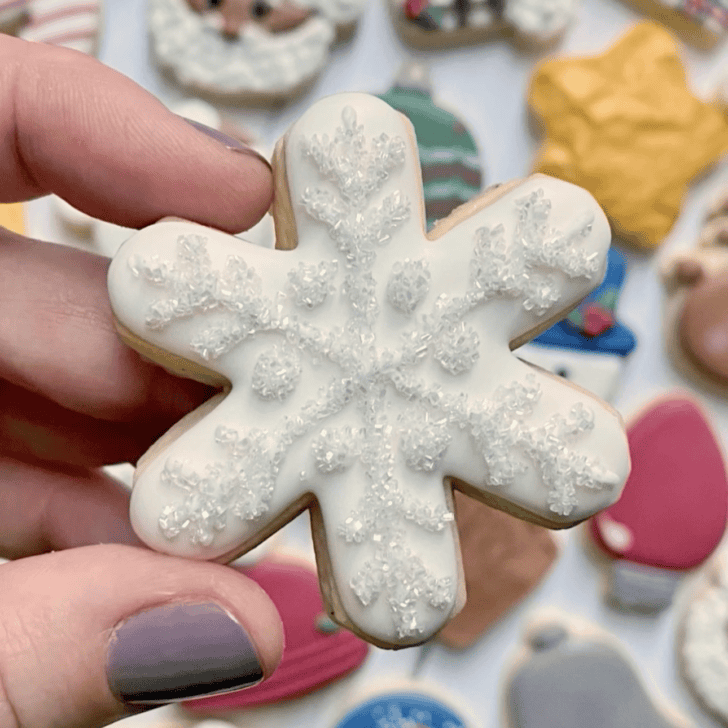 snowflake cookie decorated with royal icing