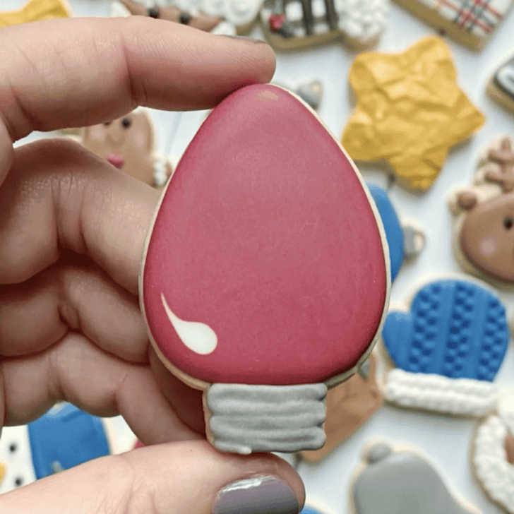 light bulb christmas cookie decorated with royal icing
