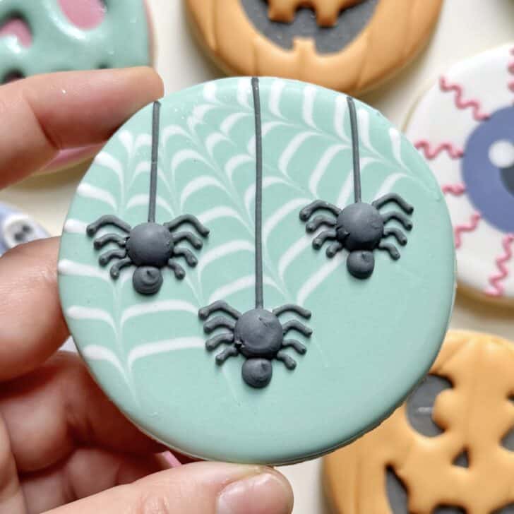 spider cookie decorated with royal icing