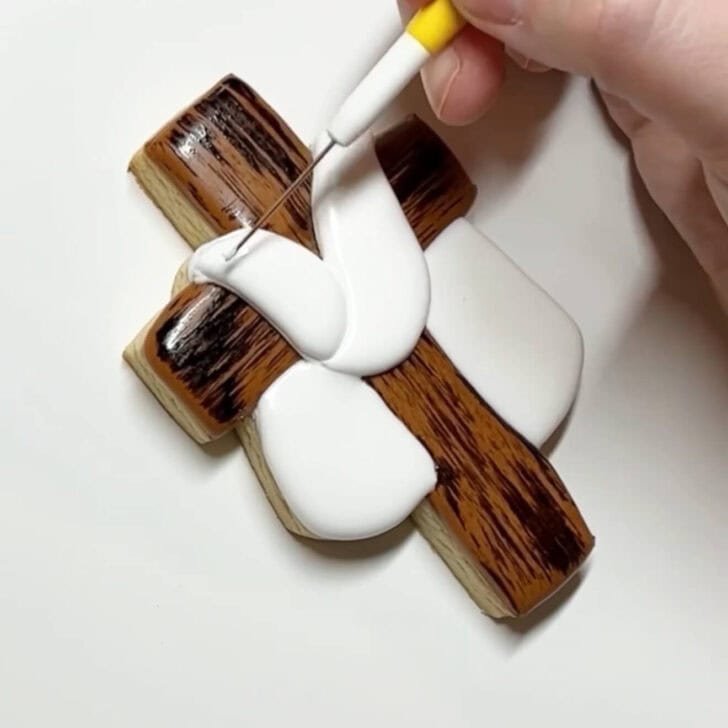 step by step instructions on how to decorate Cross Cookies for Easter with royal icing