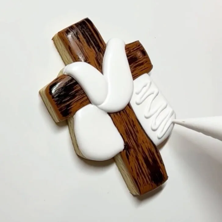 step by step instructions on how to decorate Cross Cookies for Easter with royal icing