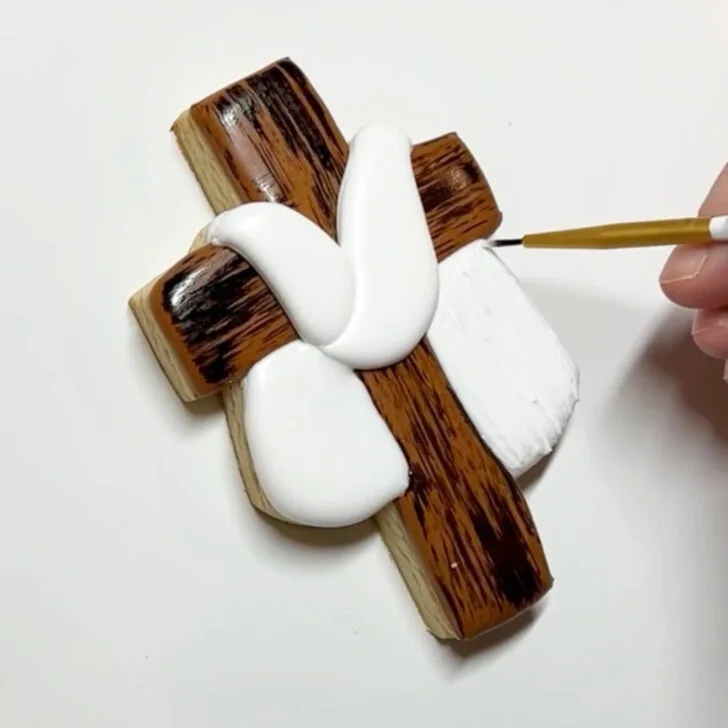 step by step instructions on how to decorate Cross Cookies for Easter with royal icing