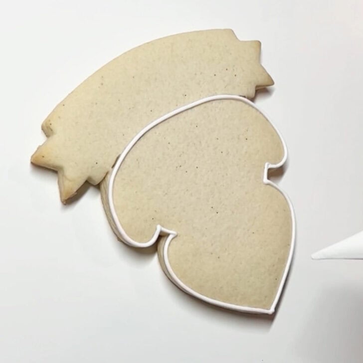 how to decorate teaching is a work of heart cookies with royal icing