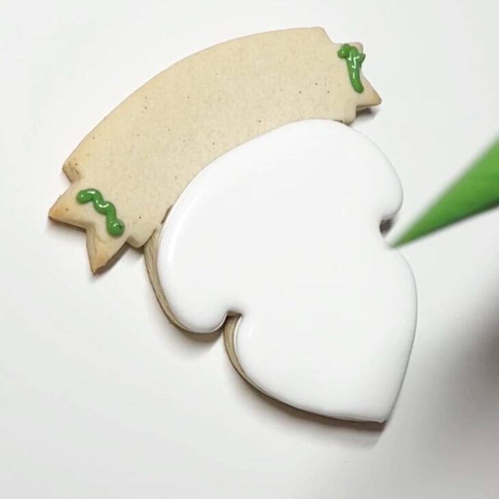 how to decorate teaching is a work of heart cookies with royal icing