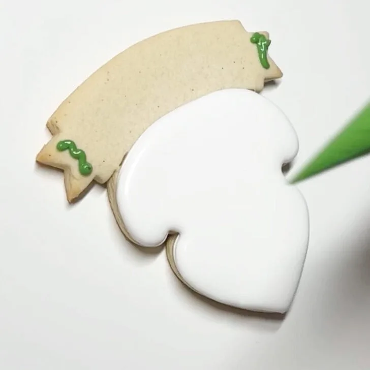 how to decorate teaching is a work of heart cookies with royal icing