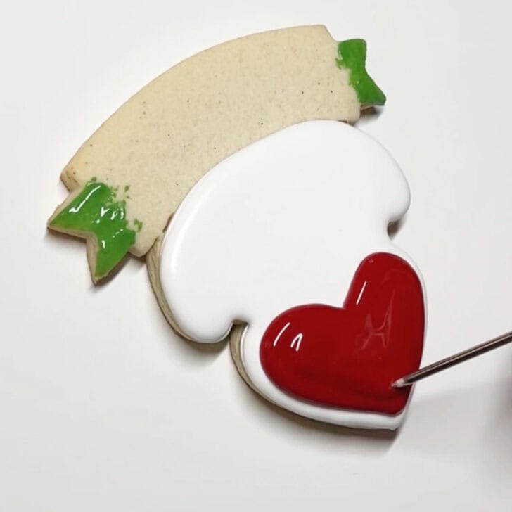 how to decorate teaching is a work of heart cookies with royal icing