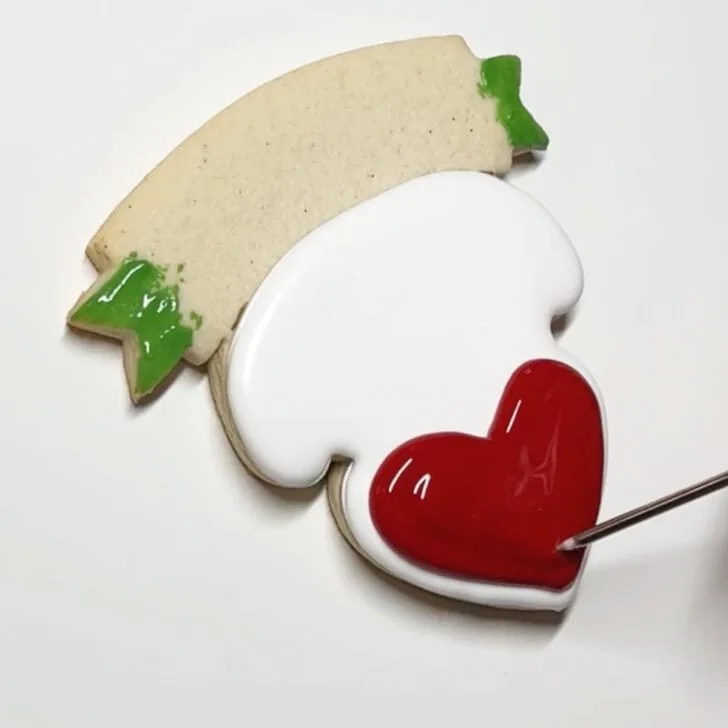 how to decorate teaching is a work of heart cookies with royal icing