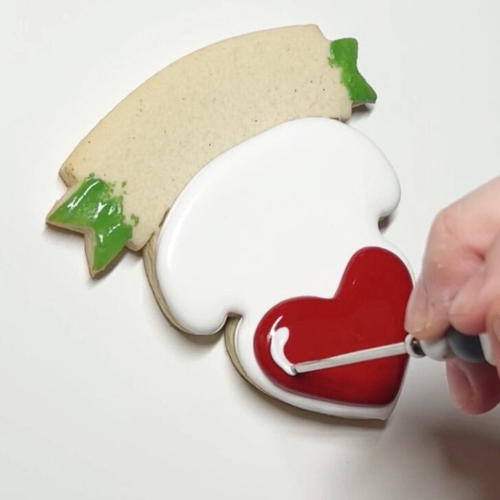 how to decorate teaching is a work of heart cookies with royal icing