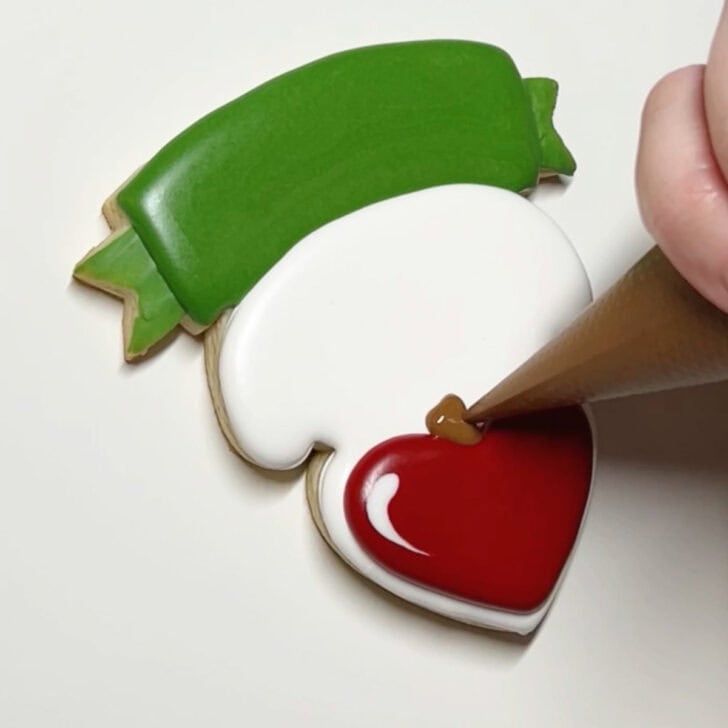 how to decorate teaching is a work of heart cookies with royal icing
