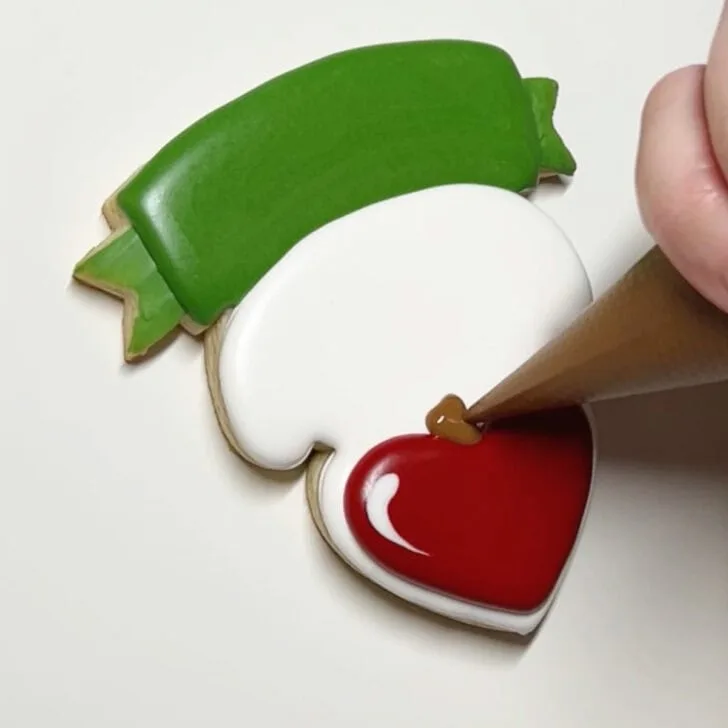 how to decorate teaching is a work of heart cookies with royal icing
