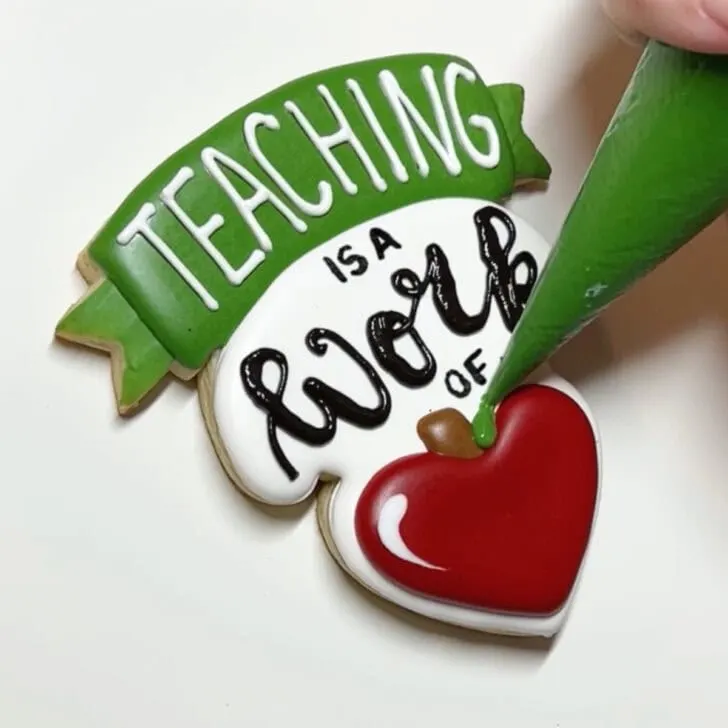 how to decorate teaching is a work of heart cookies with royal icing