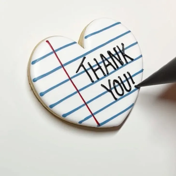 how to decorate teaching is a work of thank you cookies with royal icing