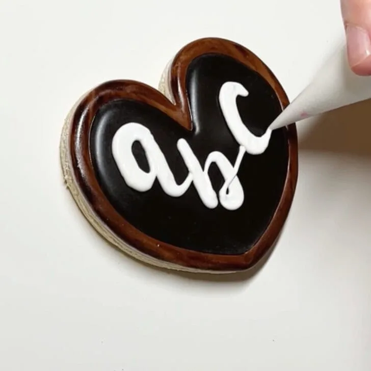 how to decorate chalkboard cookies decorated with royal icing