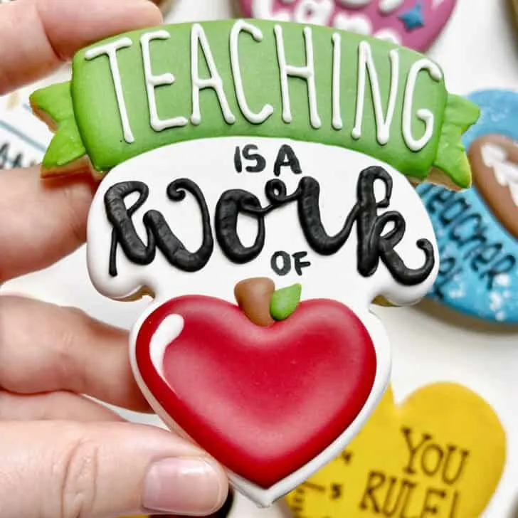 teaching is a work of heart cookies decorated with royal icing